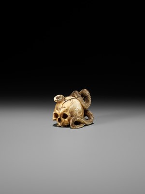 Lot 96 - A FINE IVORY NETSUKE OF A SKULL WITH A SNAKE