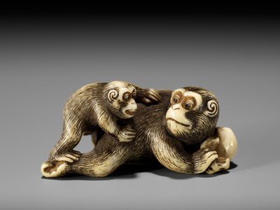 Lot 54 - GARAKU: AN IVORY NETSUKE OF A MONKEY WITH YOUNG