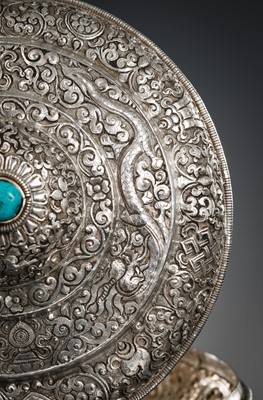 Lot 290 - A TURQUOISE-INLAID SILVER REPOUSSÉ BETEL NUT BOX AND COVER, BHUTAN, EARLY 19TH CENTURY