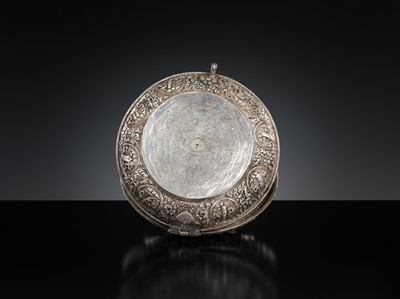 Lot 290 - A TURQUOISE-INLAID SILVER REPOUSSÉ BETEL NUT BOX AND COVER, BHUTAN, EARLY 19TH CENTURY