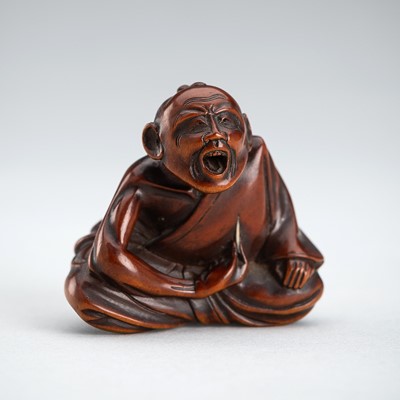 SHOKEI: A WOOD NETSUKE OF A PROFESSIONAL SNEEZER