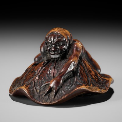 Lot 202 - HOSHUNSAI MASAYUKI: A FINE WOOD NETSUKE OF AN ONI CATCHING A TERRAPIN