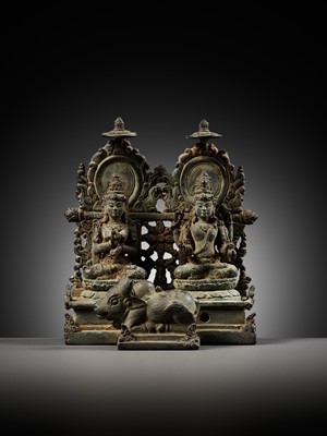 Lot 202 - A RARE BRONZE GROUP DEPICTING SHIVA AND PARVATI WITH NANDI, CENTRAL JAVA, CIRCA 900-950 AD