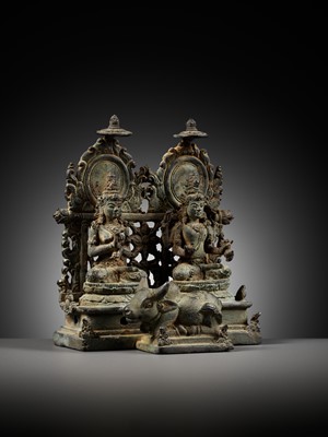 Lot 202 - A RARE BRONZE GROUP DEPICTING SHIVA AND PARVATI WITH NANDI, CENTRAL JAVA, CIRCA 900-950 AD