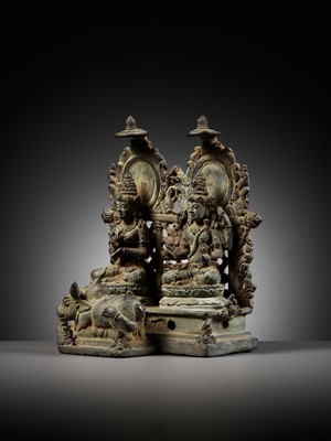 Lot 202 - A RARE BRONZE GROUP DEPICTING SHIVA AND PARVATI WITH NANDI, CENTRAL JAVA, CIRCA 900-950 AD