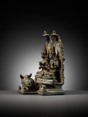 Lot 202 - A RARE BRONZE GROUP DEPICTING SHIVA AND PARVATI WITH NANDI, CENTRAL JAVA, CIRCA 900-950 AD