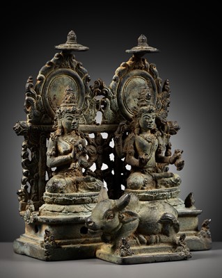 Lot 202 - A RARE BRONZE GROUP DEPICTING SHIVA AND PARVATI WITH NANDI, CENTRAL JAVA, CIRCA 900-950 AD