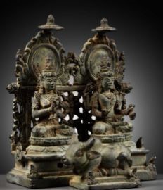 Lot 202 - A RARE BRONZE GROUP DEPICTING SHIVA AND PARVATI WITH NANDI, CENTRAL JAVA, CIRCA 900-950 AD