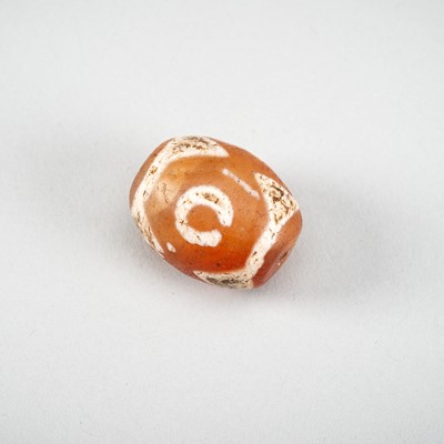 Lot 1522 - A HIMALAYAN AGATE DZI BEAD, 18TH CENTURY OR EARLIER