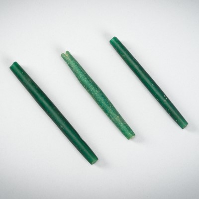 A GROUP OF THREE ANCIENT GREEN GLASS BANGLES, 202 BC-220 AD