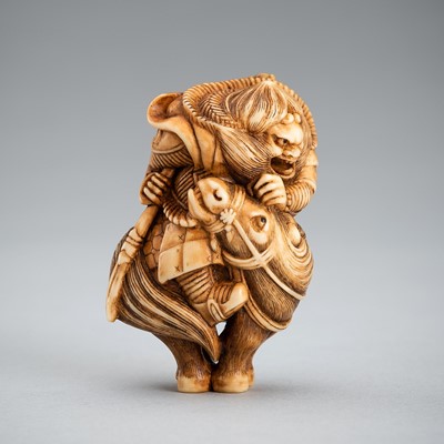 Lot 535 - VASILY PATOKIN: A MAMMOTH IVORY NETSUKE OF SHOKI ON HORSEBACK