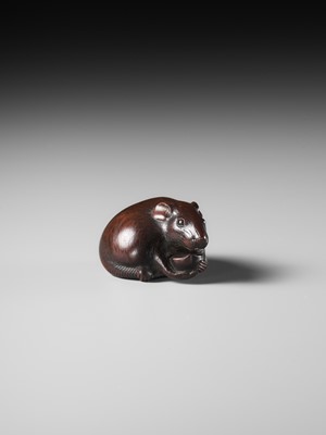 Lot 112 - TOMOKAZU: A FINE WOOD NETSUKE OF A RAT EATING A CHESTNUT