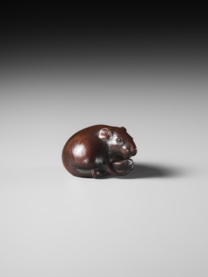 Lot 112 - TOMOKAZU: A FINE WOOD NETSUKE OF A RAT EATING A CHESTNUT