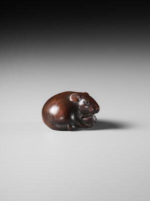 Lot 112 - TOMOKAZU: A FINE WOOD NETSUKE OF A RAT EATING A CHESTNUT