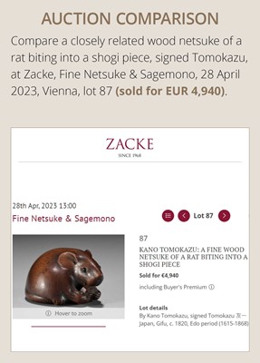 Lot 112 - TOMOKAZU: A FINE WOOD NETSUKE OF A RAT EATING A CHESTNUT