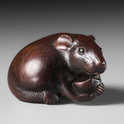 Lot 112 - TOMOKAZU: A FINE WOOD NETSUKE OF A RAT EATING A CHESTNUT