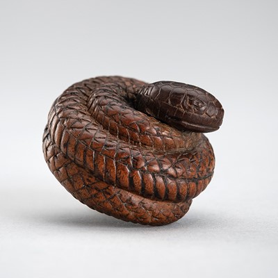 A WOOD NETSUKE OF COILED SNAKE