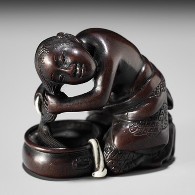 Lot 163 - MIWA: A FINE INLAID WOOD NETSUKE OF A WOMAN WASHING HER HAIR