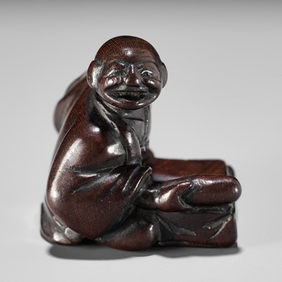 Lot 164 - A FINE EDO SCHOOL WOOD NETSUKE OF FUKAI SHIDOKEN