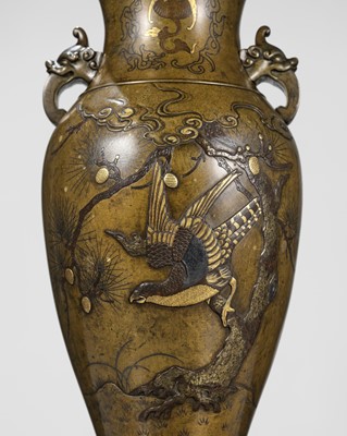 A LARGE BRONZE AND GILT VASE WITH AN EAGLE ON A PINE