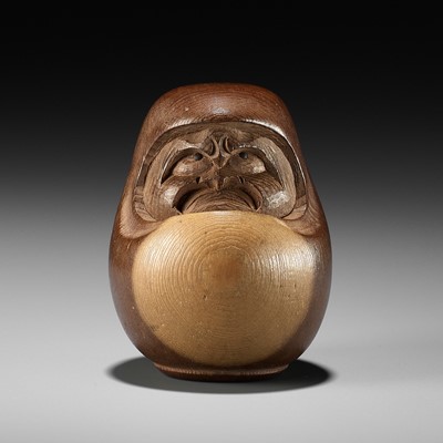 Lot 278 - SUKEYUKI: A RARE HIDA SCHOOL ITTOBORI YEW WOOD NETSUKE OF A DARUMA DOLL