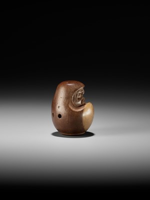 Lot 278 - SUKEYUKI: A RARE HIDA SCHOOL ITTOBORI YEW WOOD NETSUKE OF A DARUMA DOLL