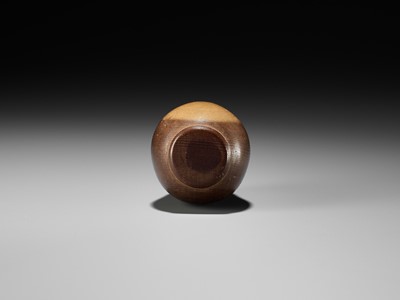 Lot 278 - SUKEYUKI: A RARE HIDA SCHOOL ITTOBORI YEW WOOD NETSUKE OF A DARUMA DOLL