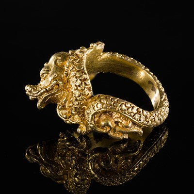 A GILT-BRONZE RING IN THE FORM OF A DRAGON, JAVA, 18TH-19TH CENTURY OR EARLIER