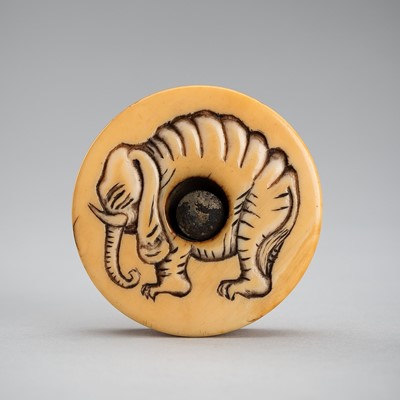 A WALRUS TUSK MANJU NETSUKE OF AN ELEPHANT, MEIJI