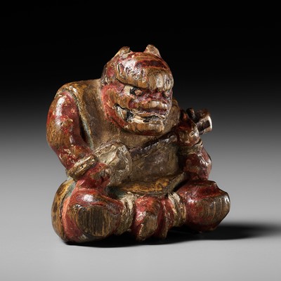 Lot 468 - A RARE SHUZAN STYLE POLYCHROME HINOKI WOOD NETSUKE OF AN ONI PLAYING THE SAMISEN