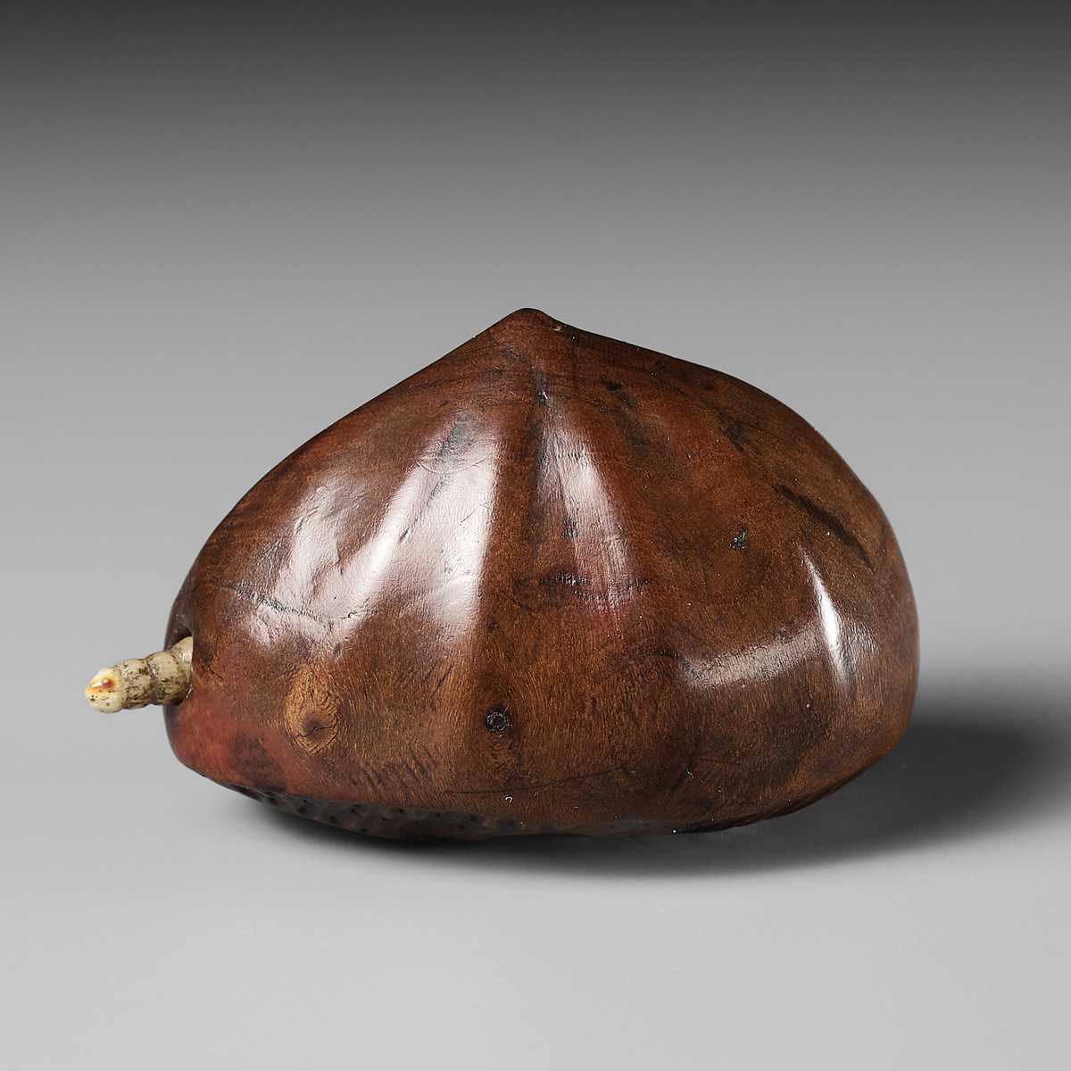 Lot 88 - MINKO: A WOOD NETSUKE OF A CHESTNUT WITH A MOVEABLE MAGGOT