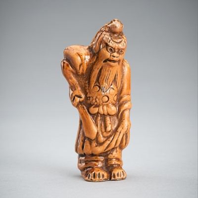 A CERAMIC NETSUKE OF SHOKI