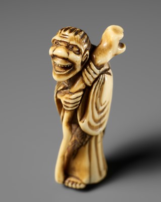 Lot 440 - AN OSAKA SCHOOL IVORY NETSUKE OF TEKKAI SENNIN