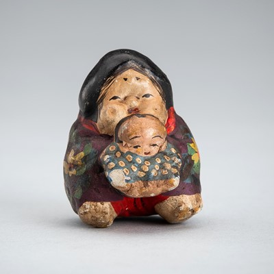 A CERAMIC ‘DOUBLE SHUNGA: NETSUKE OF OKAME WITH CHILD