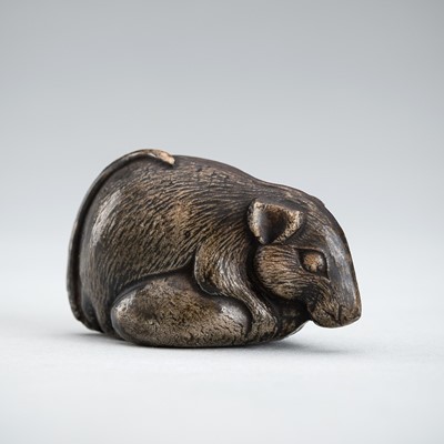 A CERAMIC NETSUKE OF A RAT EATING A CHESTNUT