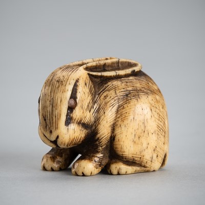 Lot 399 - A FINE BONE NETSUKE OF A RABBIT, EDO PERIOD