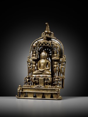 Lot 254 - A JAIN SILVER AND COPPER-INLAID BRASS SHRINE TO SAMBHAVANATHA, DATED 1464