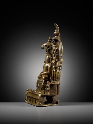 Lot 254 - A JAIN SILVER AND COPPER-INLAID BRASS SHRINE TO SAMBHAVANATHA, DATED 1464