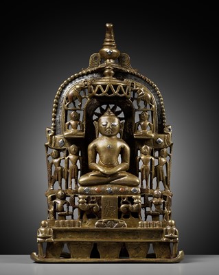 Lot 254 - A JAIN SILVER AND COPPER-INLAID BRASS SHRINE TO SAMBHAVANATHA, DATED 1464