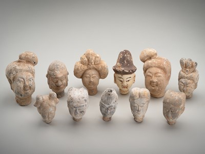 Lot 1832 - A LOT WITH ELEVEN TERRACOTTA HEADS, HAN TO TANG DYNASTY