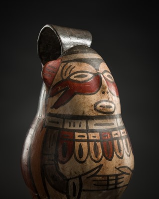 Lot 135 - A PAINTED FIGURAL BRIDGE-AND-SPOUT BOTTLE, NASCA CULTURE