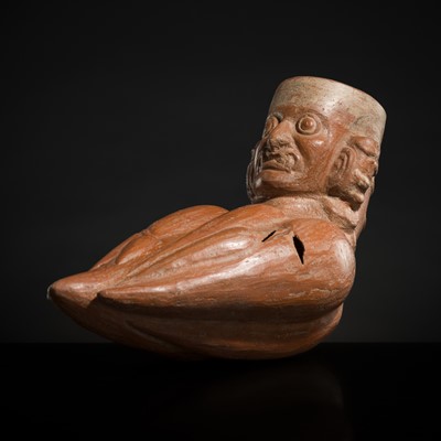 Lot 140 - A CERAMIC FACE-NECK VESSEL IN FORM OF YUCA ROOTS WITH THE HEAD OF A WRATHFUL DEITY, VICÚS CULTURE