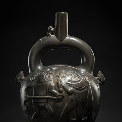 Lot 132 - A CERAMIC STIRRUP-SPOUT VESSEL WITH TWO MYTHICAL CREATURES BATTLING AN ANACONDA, CHIMÚ CULTURE