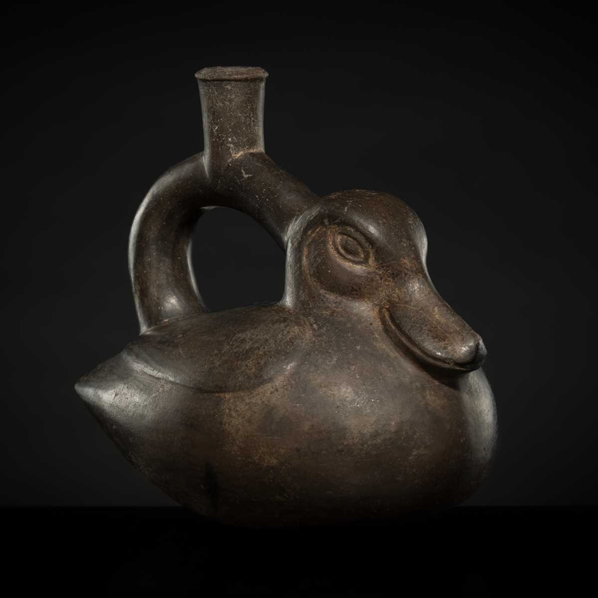 Lot 129 - A CERAMIC STIRRUP-SPOUT VESSEL IN THE FORM OF A DUCK, MOCHE CULTURE