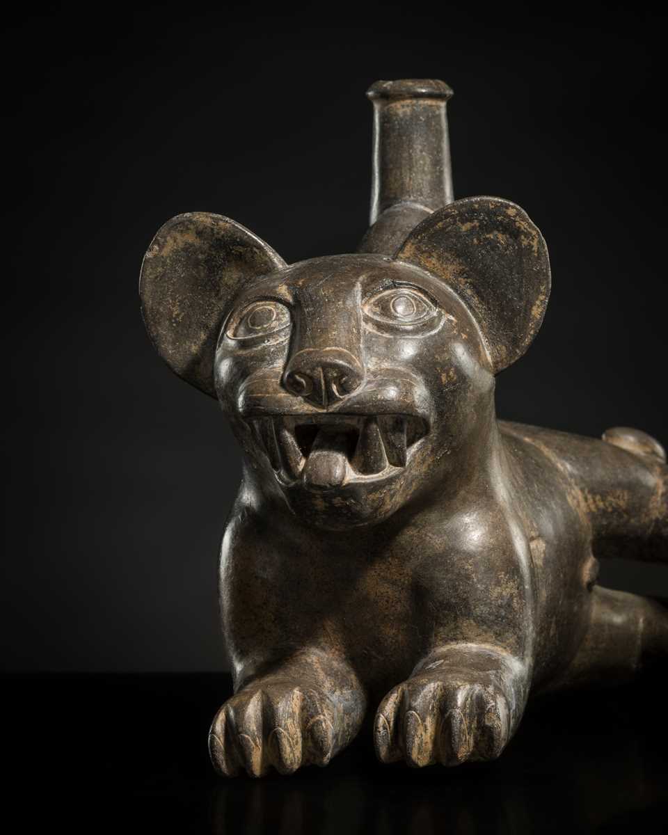 Lot 128 - A CERAMIC STIRRUP-SPOUT VESSEL IN THE FORM OF A TIGRILLO WILD CAT, MOCHE CULTURE