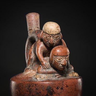 Lot 143 - A CERAMIC STIRRUP-SPOUT VESSEL WITH AN EROTIC SCENE, MOCHE CULTURE