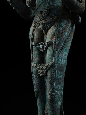 Lot 223 - A RARE AND EXCEPTIONALLY LARGE BRONZE FIGURE OF DEWI SRI, BORNEO, 12TH CENTURY