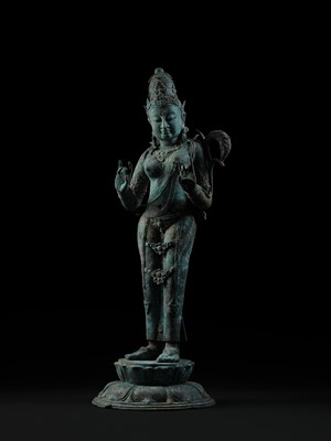 Lot 223 - A RARE AND EXCEPTIONALLY LARGE BRONZE FIGURE OF DEWI SRI, BORNEO, 12TH CENTURY