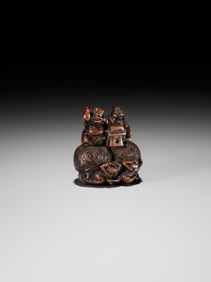 Lot 15 - KAZUNORI: A LARGE WOOD NETSUKE OF DAIKOKU AND EBISU AT SETSUBUN