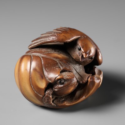 Lot 466 - A COROZO NUT NETSUKE-OKIMONO OF A SPARROW AND FROG